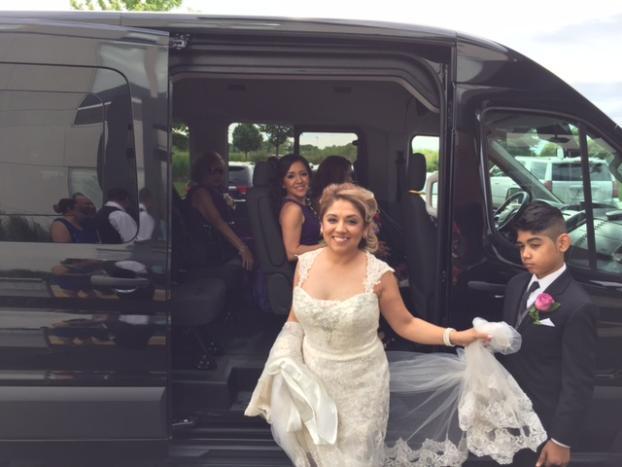 Local wedding transportation service in Chicagoland, Bride exiting a Sprinter van on her wedding day, from Stop & Go Limo Airport Shuttle Service.
