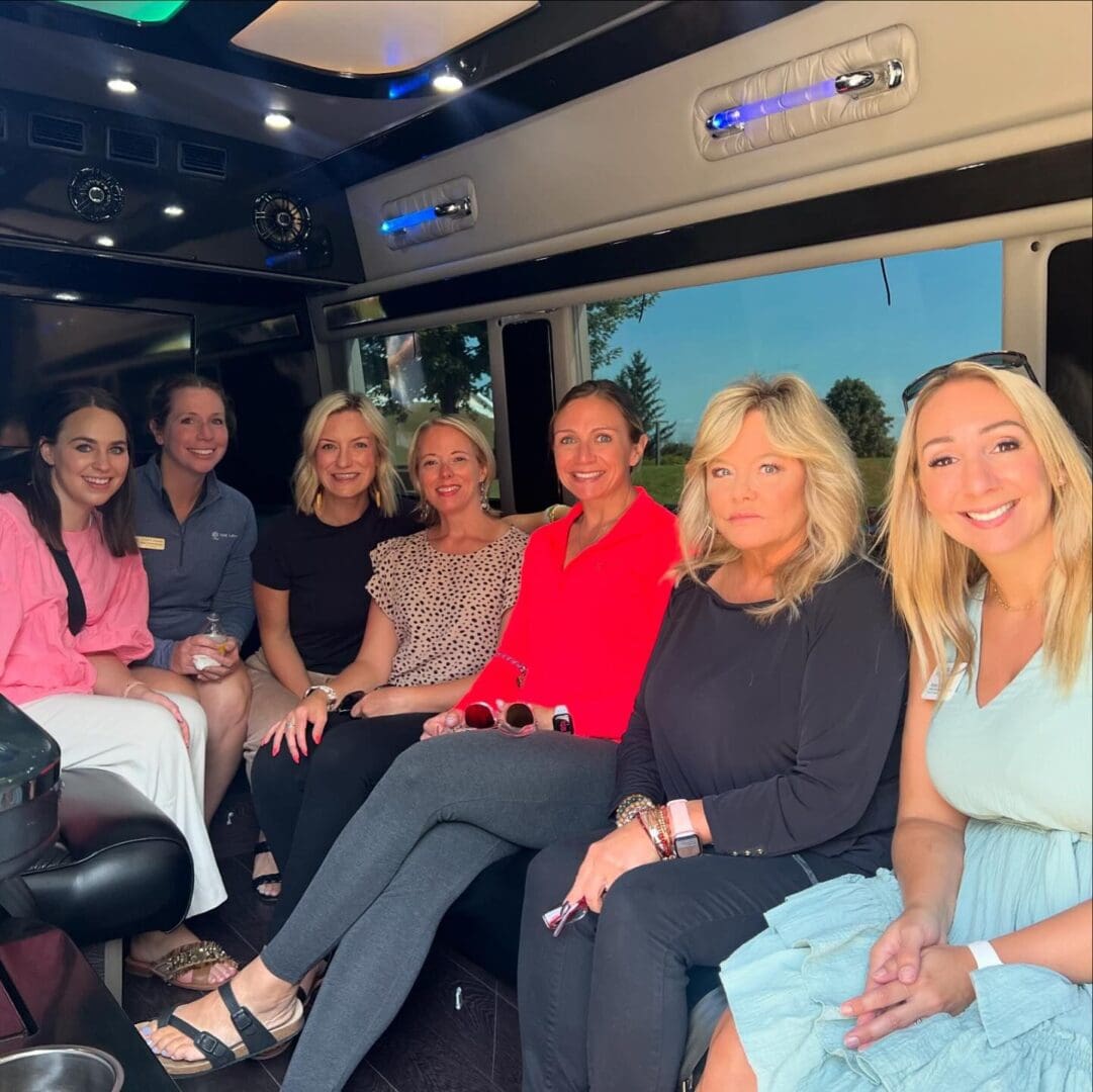 Local party bus rental service in Chicagoland, Group of women celebrating inside a party bus, from Stop & Go Limo Airport Shuttle Service.