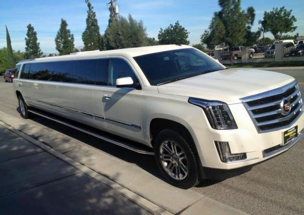 Local limousine service in Chicagoland, Cadillac Escalade stretch limousine on the street, from Stop & Go Limo Airport Shuttle Service.