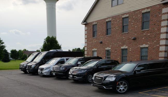 Local luxury transportation service in Chicagoland, Full lineup of luxury fleet vehicles in a parking lot, from Stop & Go Limo Airport Shuttle Service.
