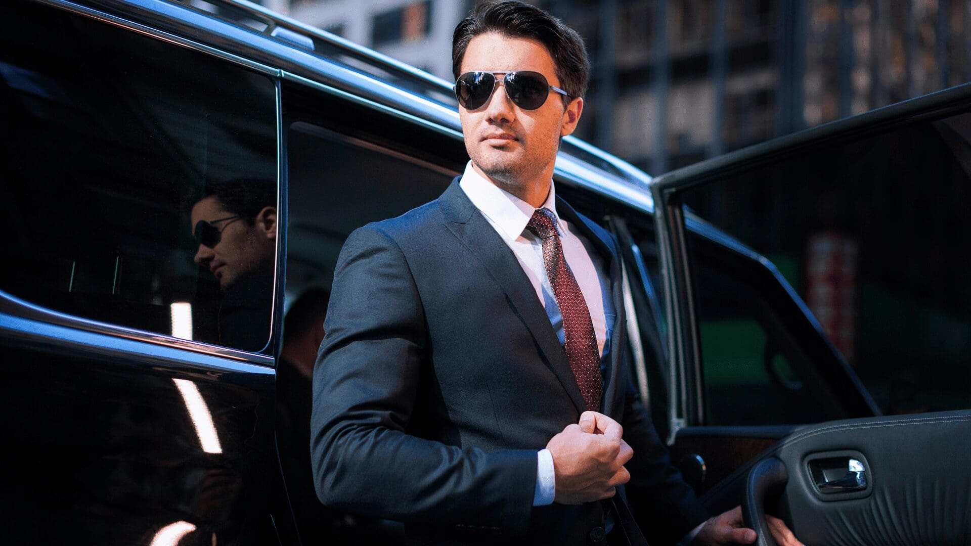 Local airport shuttle service in Chicagoland, Airport Shuttle Service professional chauffeur in suit ready for client pickup, from Stop & Go Limo Airport Shuttle Service.
