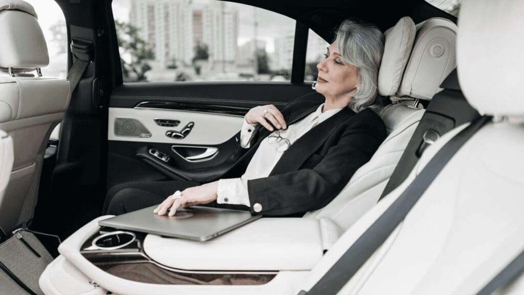 Local airport shuttle service in New Lenox, Passenger relaxing in a luxury town car, Airport Shuttle Service, New Lenox, Illinois, from Stop & Go Limo Airport Shuttle Service.
