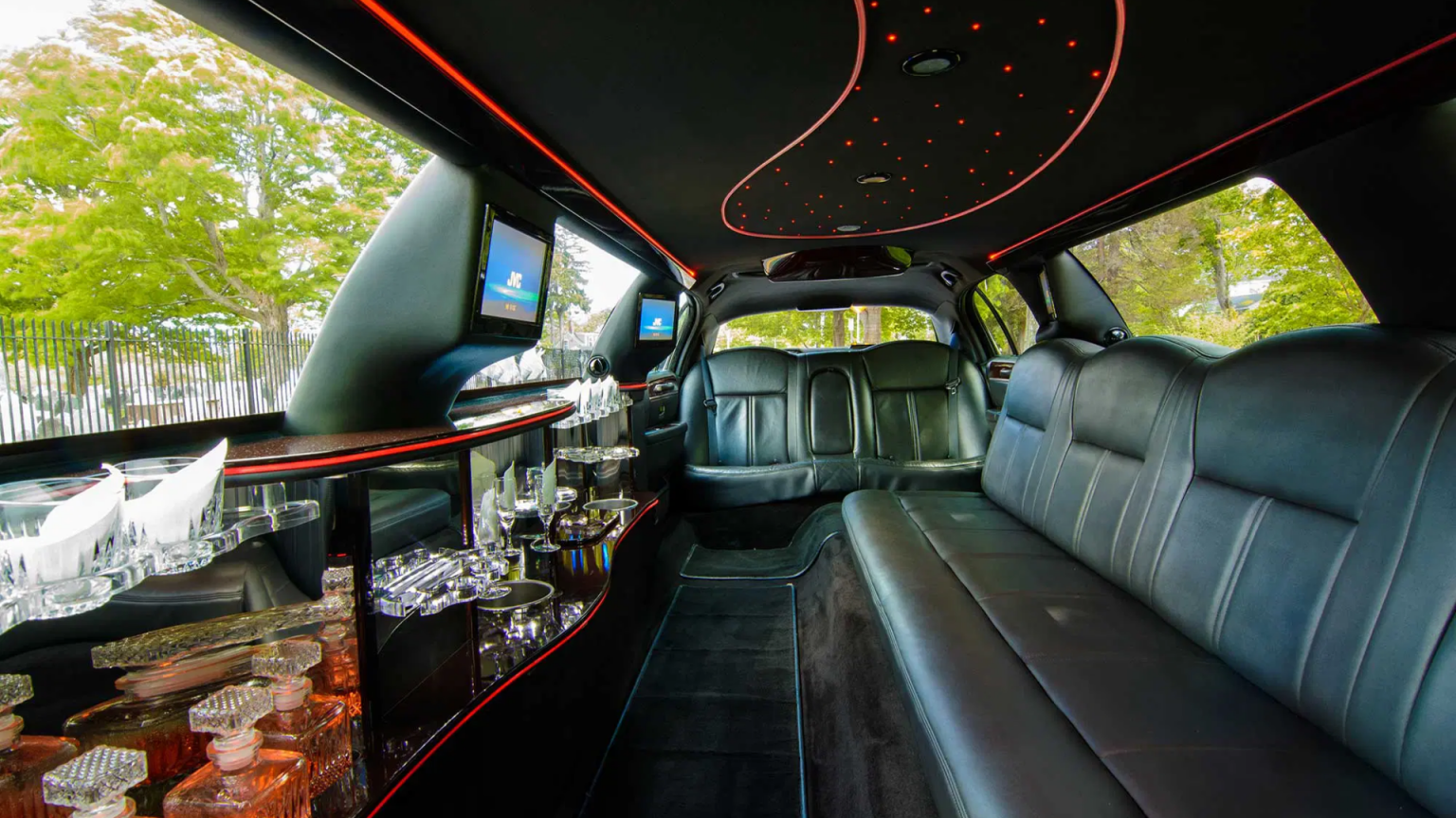 Local limousine service in Chicagoland, Luxurious limousine interior with premium leather seating and ambient lighting, from Stop & Go Limo Airport Shuttle Service.