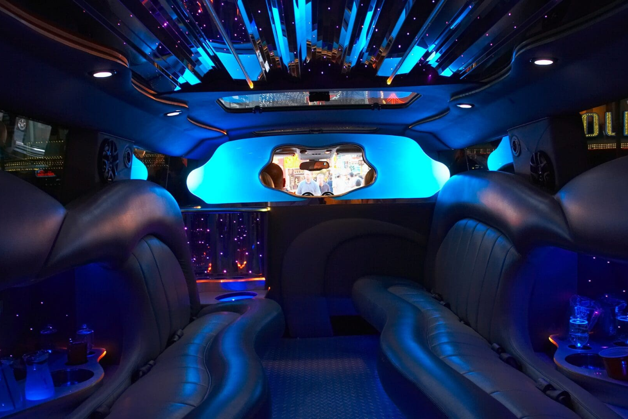 Local airport shuttle service in Chicagoland, Professional Airport Shuttle Service limousine chauffeur ready to assist a client, from Stop & Go Limo Airport Shuttle Service.