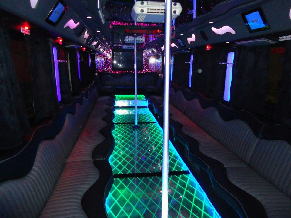 Local party bus rental service in Chicagoland, Party bus interior with LED lighting and premium seating, from Stop & Go Limo Airport Shuttle Service.