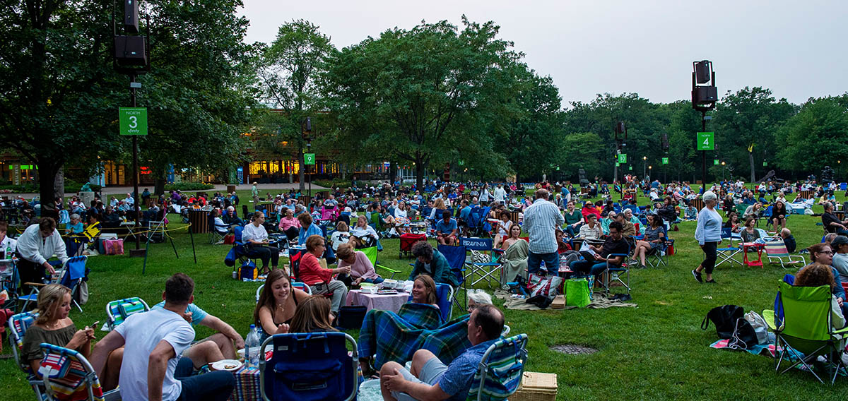 Local concert transportation service in Chicagoland, Ravinia Festival lawn crowd enjoying a summer concert in Highland Park, Illinois, from Stop & Go Limo Airport Shuttle Service.