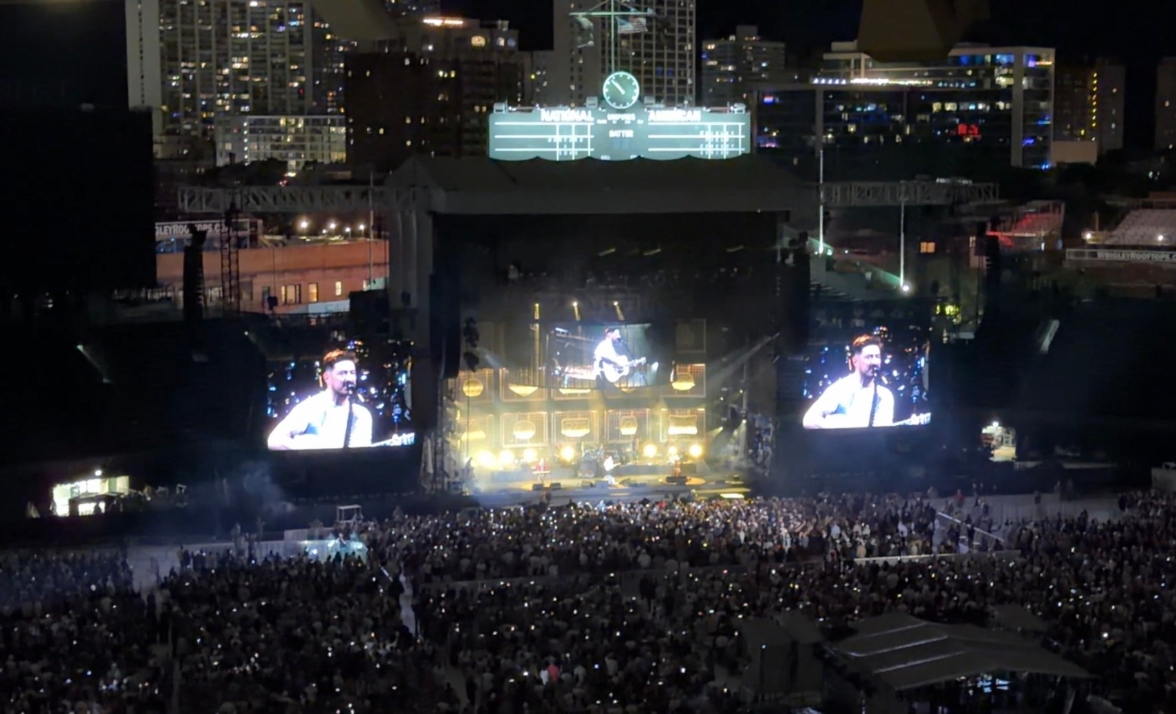 Local concert transportation service in Chicago, Wrigley Field exterior at night lit up for a summer concert, Chicago, Illinois, from Stop & Go Limo Airport Shuttle Service.