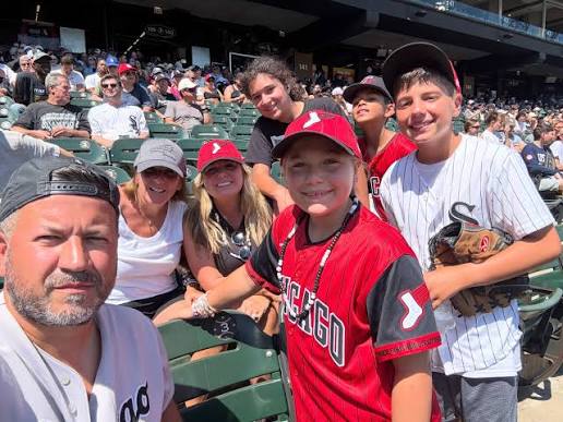 Local airport shuttle service in Chicago, A family enjoying a Chicago White Sox game at Rate Field, served by Airport Shuttle Service, from Stop & Go Limo Airport Shuttle Service.